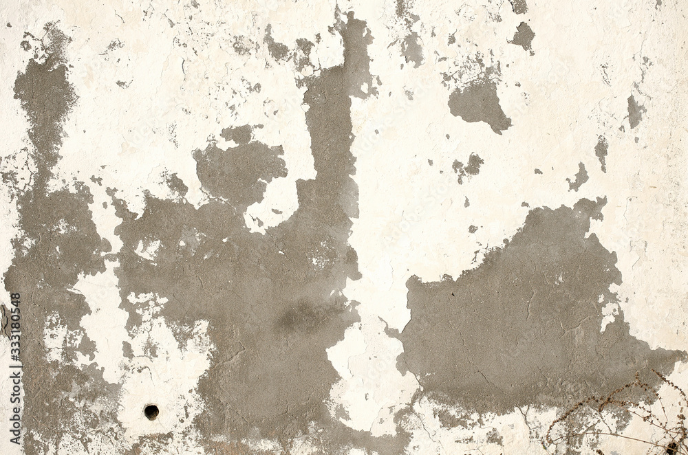 Light building background. gray wall of old house closeup. White peeling plaster. Cracks on the surface of building or fence. City building concept. Copy space. Place for text. Selective focus image. Light building background. gray wall of old house closeup. White peeling plaster. Cracks on the surface of building or fence. City building concept. Copy space. Place for text. Selective focus image.