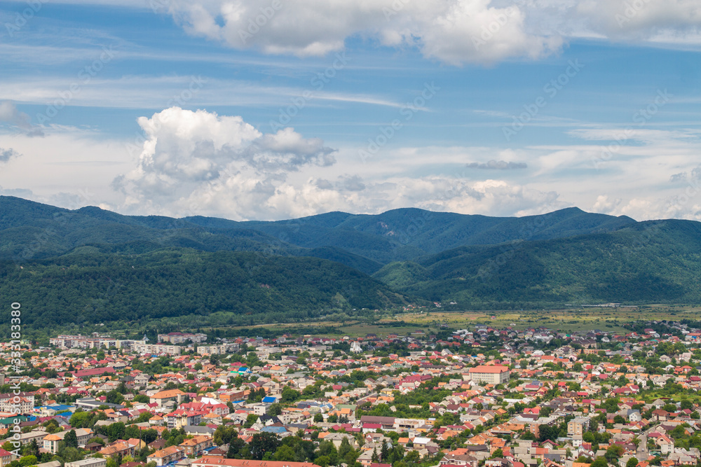 view of the city from above: houses and mountains