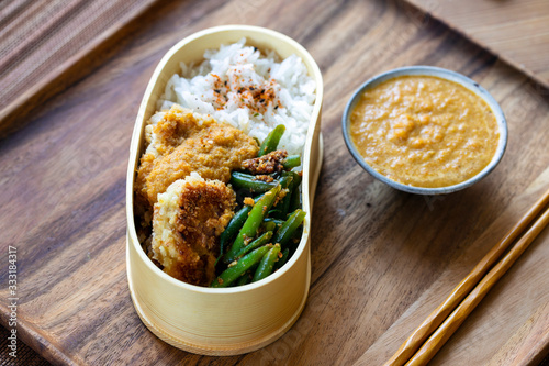 Chicken with katsu curry, rice, and green beans photo