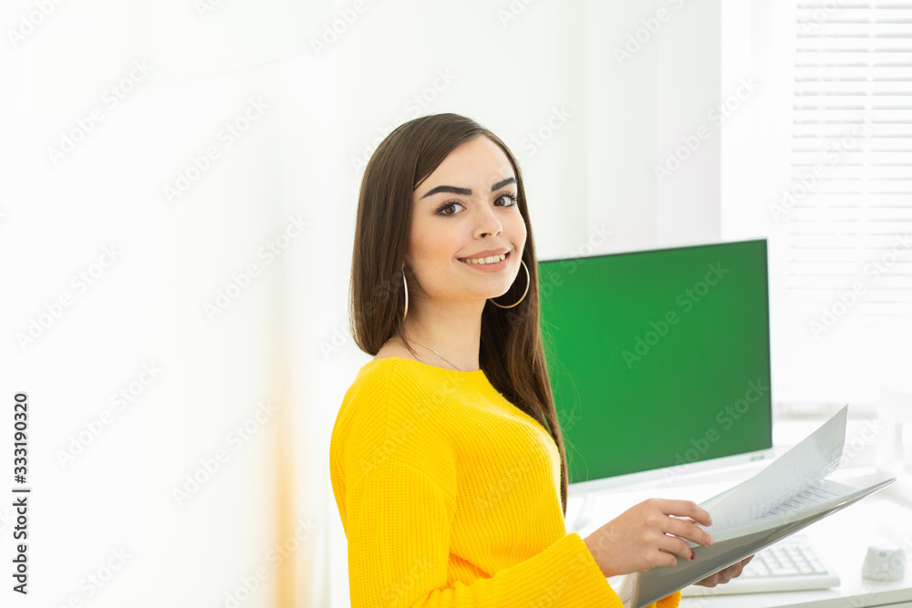 Woman in a yellow sweater working from home during Coronavirus quarantine. Health care. Staying at home Woman in a yellow sweater working from home during Coronavirus quarantine. Health care. Staying at home