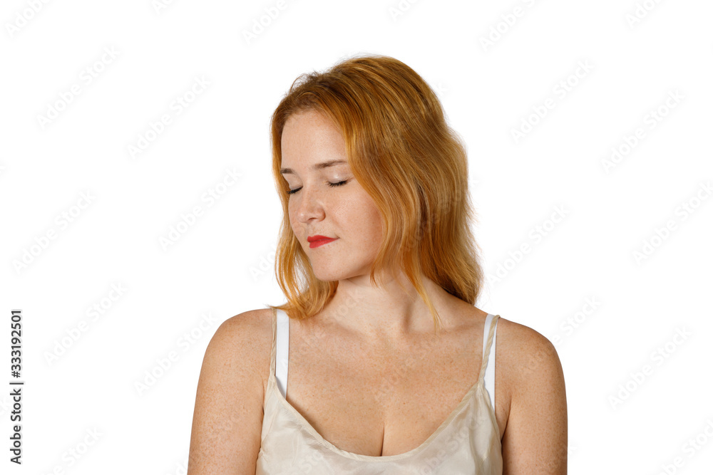Portrait of a redheaded young woman with closed eyes Portrait of a redheaded young woman with closed eyes