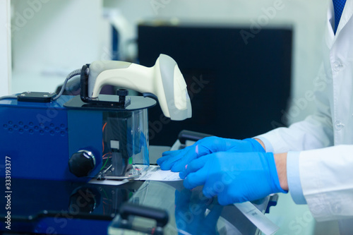 DNA laboratory. The expert puts the human DNA into the database using advanced laboratory technologies