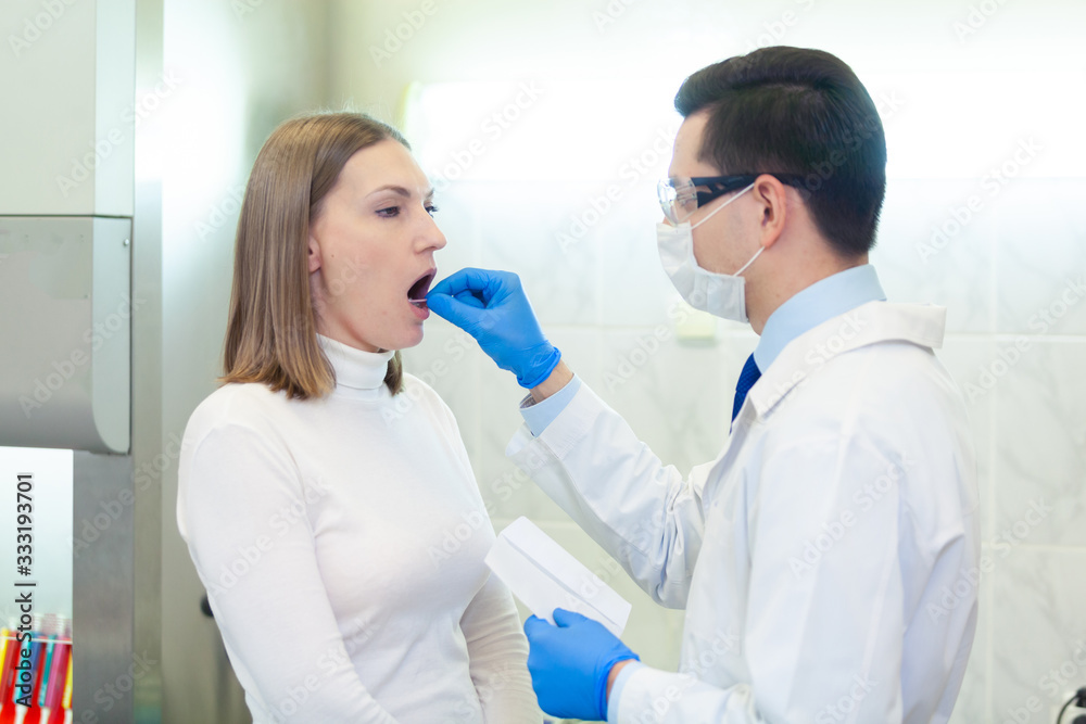 Laboratory worker performing DNA paternity test in a medical laboratory. Implementation of DNA sampling in humans Laboratory worker performing DNA paternity test in a medical laboratory. Implementation of DNA sampling in humans
