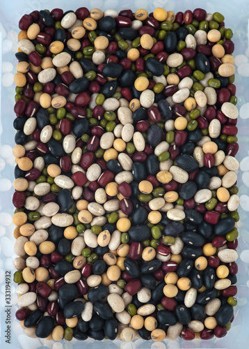 different types of beans on placed in a plastic box  close up