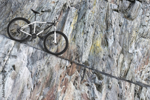 Black and White Mountain Bike on a Winding Rocky Mountain Road. 3d Rendering