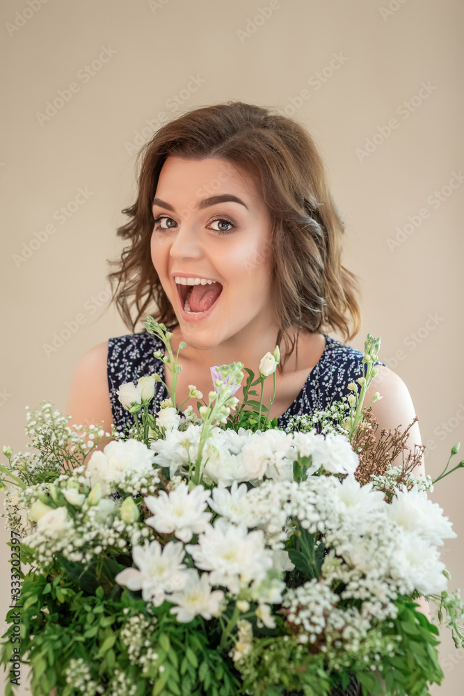 The girl suffers from pollen allergy during flowering. Allergy free concept. Freedom. emotional woman is blowing her nose near flowers in bloom The girl suffers from pollen allergy during flowering. Allergy free concept. Freedom. emotional woman is blowing her nose near flowers in bloom