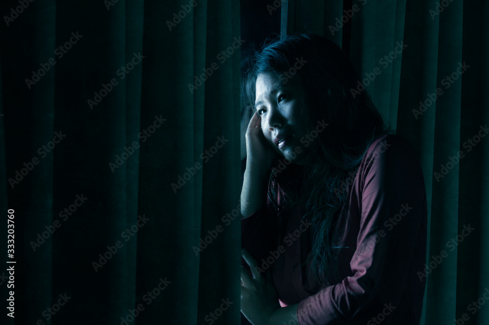 young beautiful scared and depressed Asian Chinese woman feeling overwhelmed and in panic lockdown alone at home during covid-19 virus outbreak quarantine young beautiful scared and depressed Asian Chinese woman feeling overwhelmed and in panic lockdown alone at home during covid-19 virus outbreak quarantine