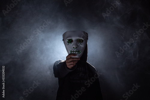 a boy with a scary mask