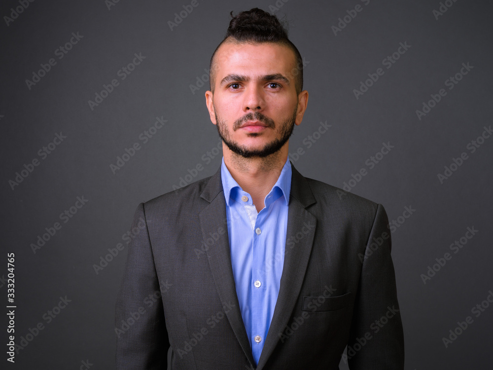 Face of handsome bearded Turkish businessman in suit Face of handsome bearded Turkish businessman in suit