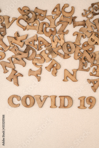 Epidemic corona virus covid 19 written with wooden letters