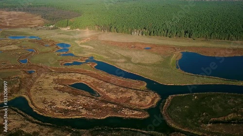 aerial view of river and meadows in autumn, Stunning aerial shot over lush autumn fields and meadows in the countryside, Sunny autumn day in a nature park photo