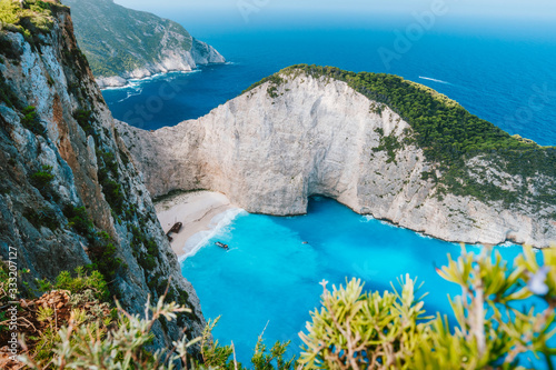 Navagio beach or Shipwreck bay. Turquoise water and pebble white beach in morning light. Famous landmark of Zakynthos island, Greece