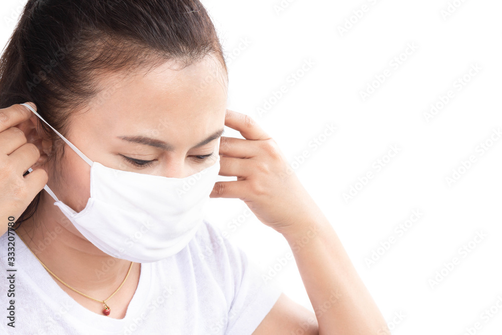 Closeup woman wearing face mask for protect air polution with white background, health care and medical concept Closeup woman wearing face mask for protect air polution with white background, health care and medical concept
