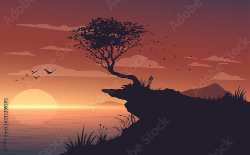 Sunset landscape with sea and tree on shore