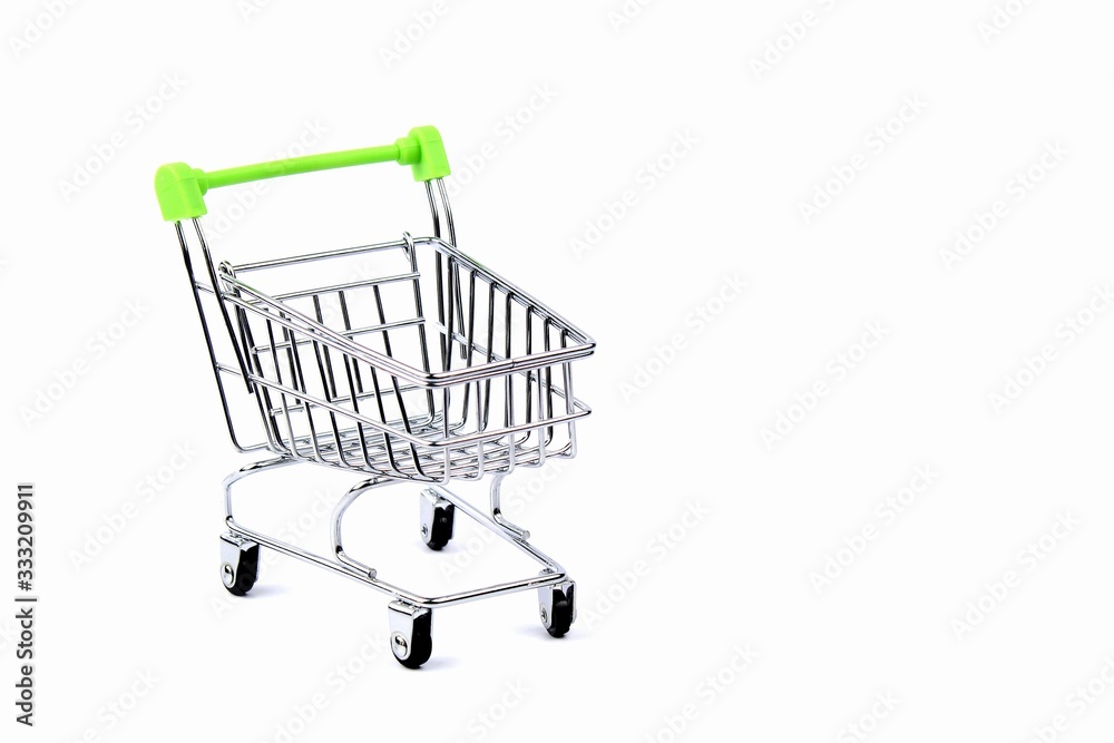 An empty grocery cart from a supermarket. There is a shortage of products in the store due to the coronavirus epidemic. Quarantine and isolation of the population in cities of many countries.