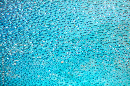 Drops of water on a blue background