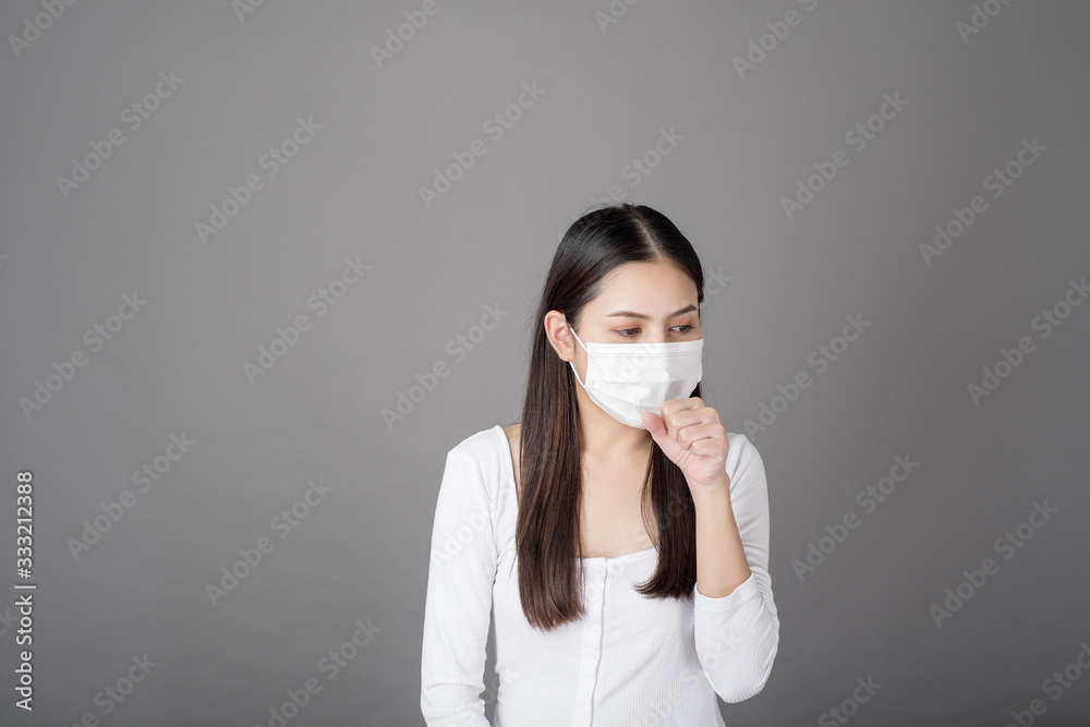 Portrait of woman with surgical mask in studio, Health care concept Portrait of woman with surgical mask in studio, Health care concept