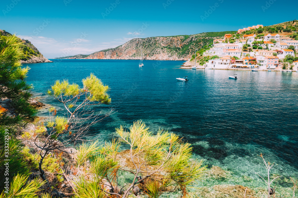 Mediterranean town Assos in calm sea cove and mountain coast at Kefalonia Island, Greece