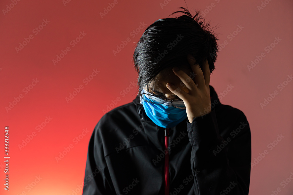 Asian man wearing mask Feeling stressed in red background