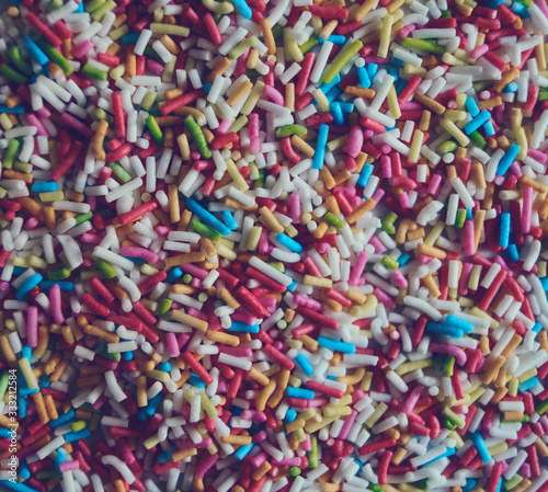 colorful abstract background texture of sweet sprinkles sugar macro photo