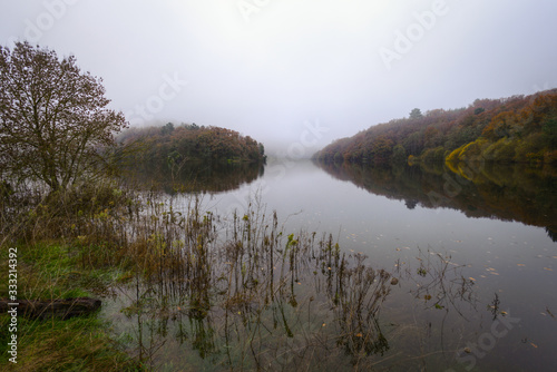 Foggy Morning next to a River with calm waters