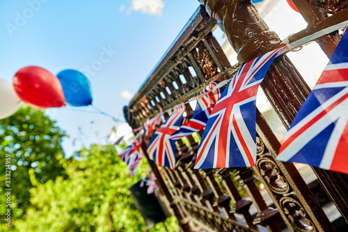 Billede på lærred British Union Jack bunting flags against blue sky