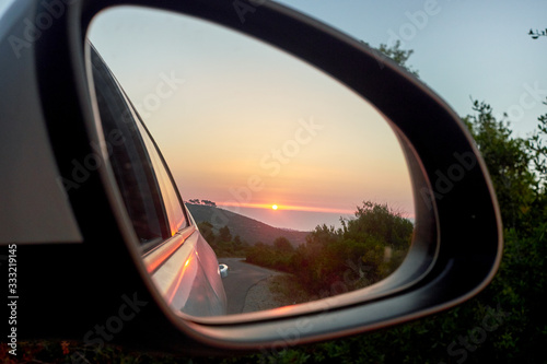 Sunset in the mirror of the car and sea © alejandroav
