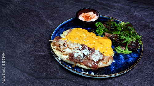 Beef janbon, chedar cheese, onion and fresh salad photo