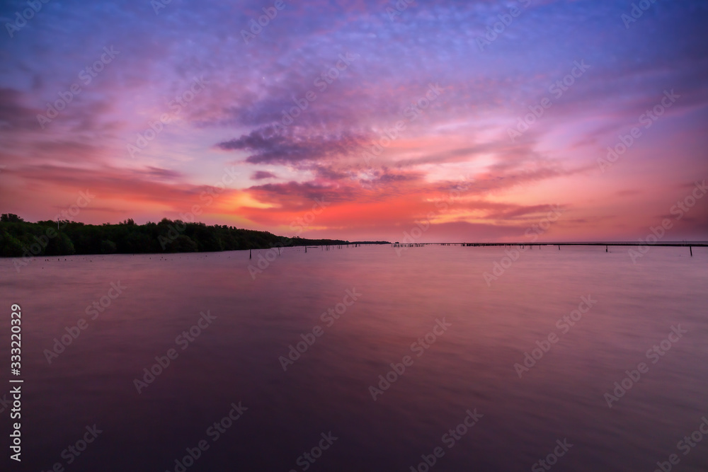 Beautiful landscape beach and sea and purple sky at the sunset, twilight period which including of sunrise