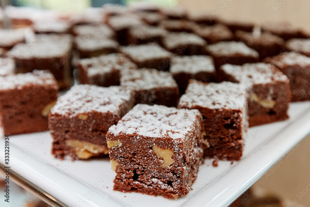 chocolate cakes with nuts on a plate