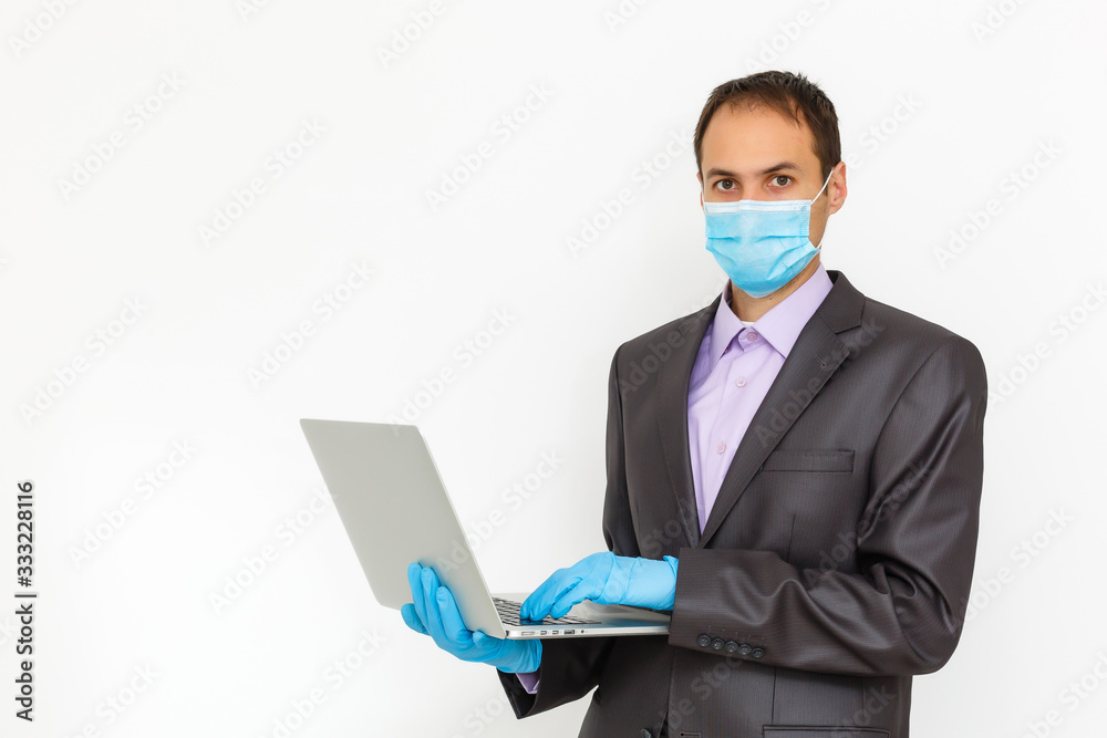 Close up of a businessman in a suit wearing Protective face mask, get ready for Coronavirus and pm 2.5 fighting against gray background. Healthcare concept. Close up of a businessman in a suit wearing Protective face mask, get ready for Coronavirus and pm 2.5 fighting against gray background. Healthcare concept.
