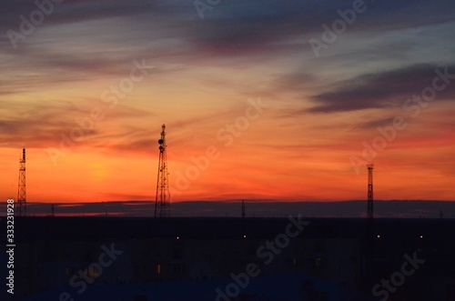  Orange sunset  colorful sky. The clouds. Electric tower.