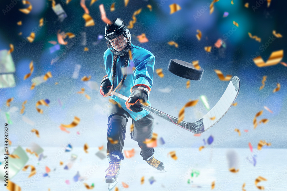 Naklejka premium Match winner. Professional sportswoman caught in moment of winning and confetti flying. Motion and action, reaching target, sport and healthy lifestyle concept. Competition, championship. Hockey