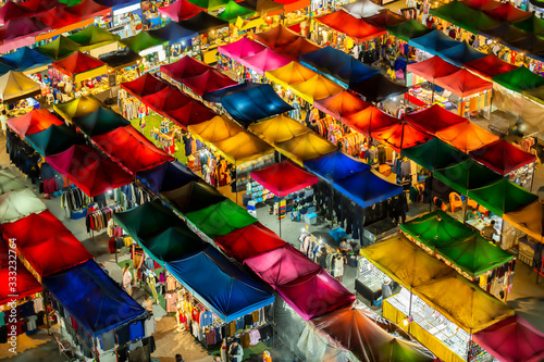 Bird eyes view of Multi-colored tents /Sales of second-hand market at twilight. © funfunphoto