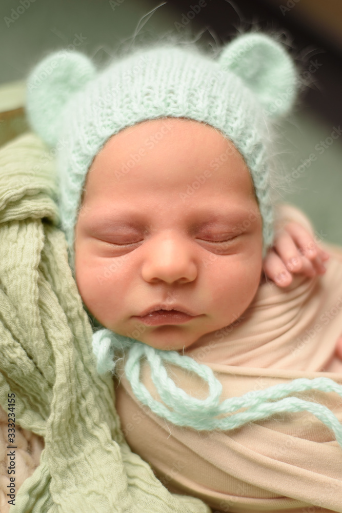 Closeup portrait of newborn baby with smile on face. Healthy and medical concept.