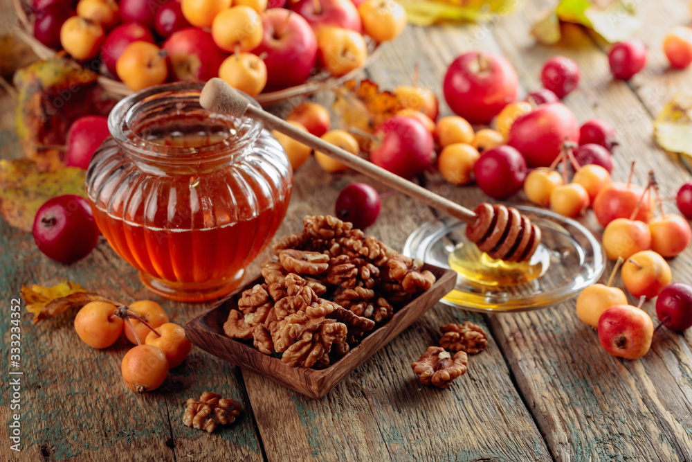 Red and yellow crab apples with honey and walnuts, healthy organic food. Red and yellow crab apples with honey and walnuts, healthy organic food.