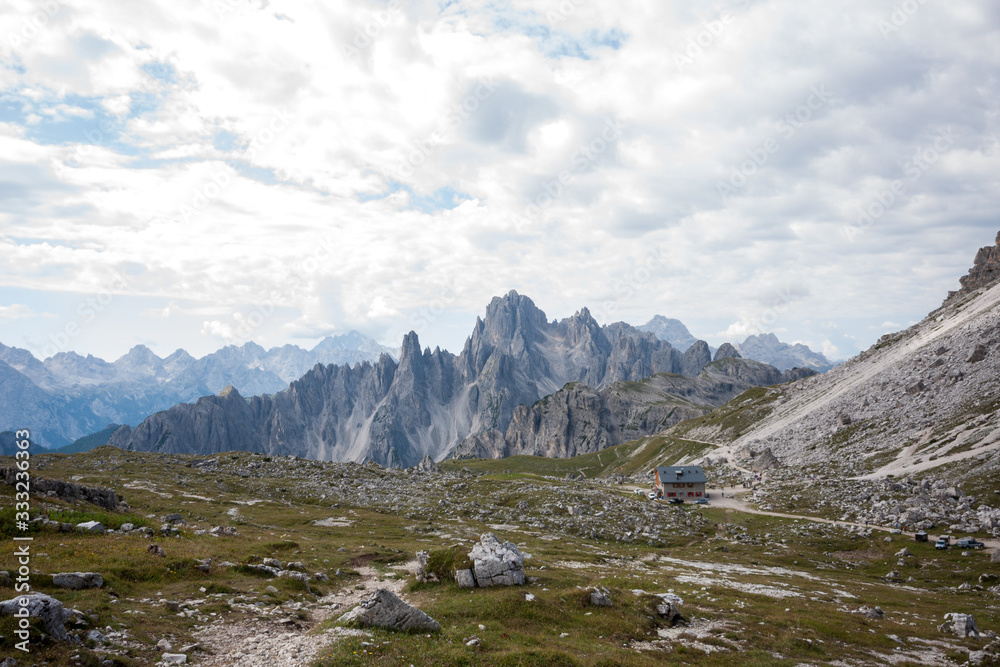 Panorama of Dolomites mountains with (Rifugio) refuge Lavaredo. National Park Tre Cime di Lavaredo, Alps mountain chain, Trentino Alto Adige region, Sudtirol, Italy