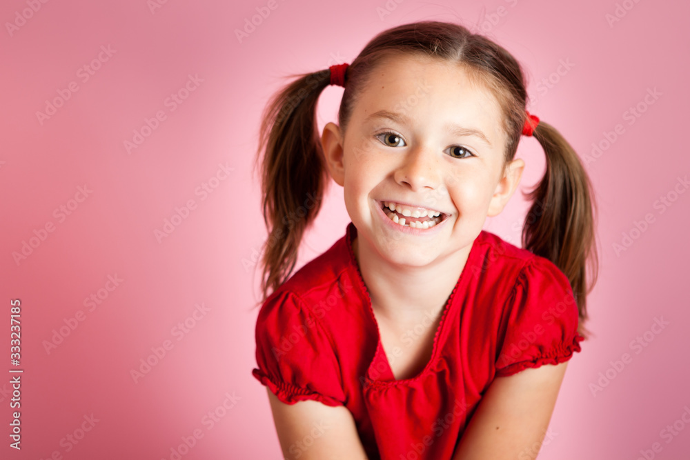 Happy Girl Smiling on Pink Background, Studio Portrait Happy Girl Smiling on Pink Background, Studio Portrait