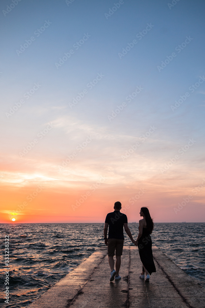 silhouette of couple at sunrise
