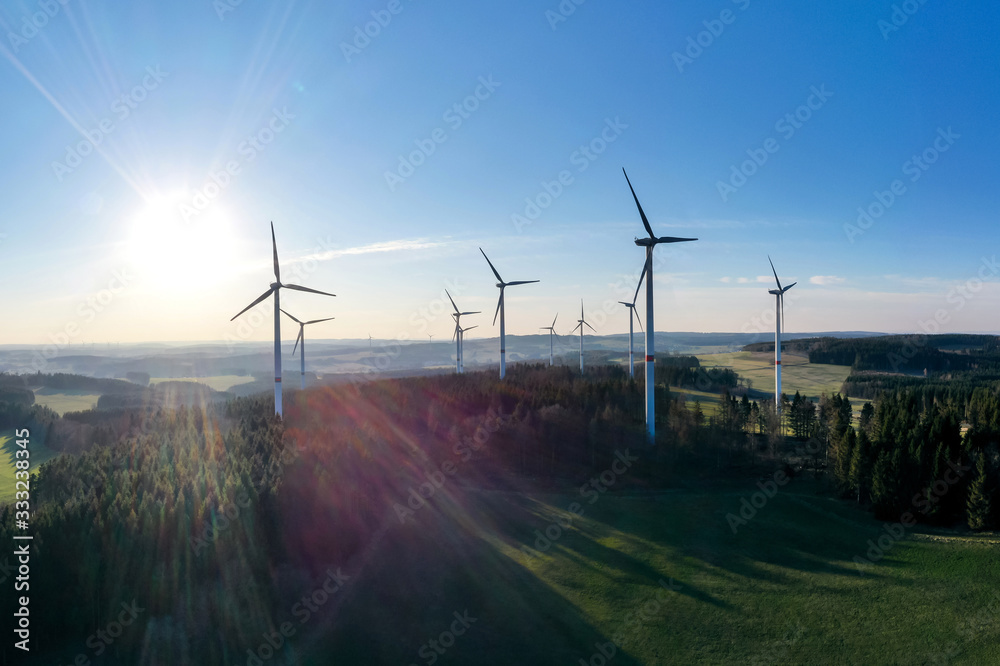Obraz premium wind wheels in an evening countryscape