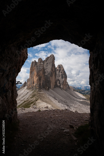 view of the dolomites through a window of Remains of military trenches on Monte Paterno - path of chamois. National Park Tre Cime di Lavaredo, Alps mountain chain, Trentino Alto Adige, Sud tiro