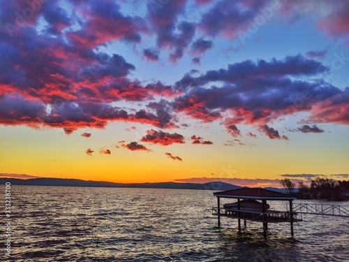 Red Sunset on Lake against Mountains © betty