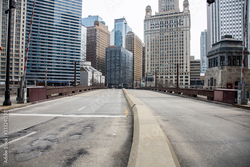 Chicago,IL/USA-March 24th 2020: Streets of downtown Chicago around State street and Michigan ave are completely isolated, desolated, empty  due the national health pandemic Covid-19. Business suffer