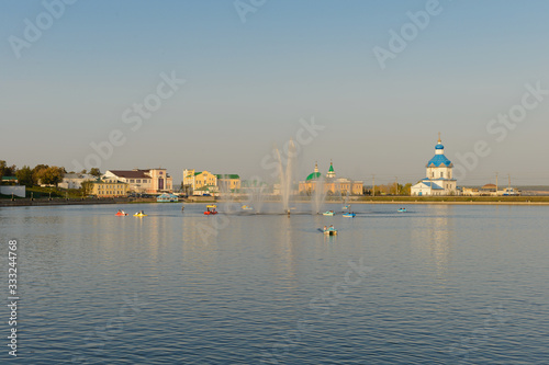 September 26, 2019: Photo of the Cheboksary Bay with a fountain and people riding in boats and catamarans. Cheboksary. Russia.