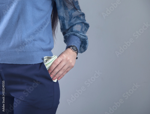 woman hand money in pocket