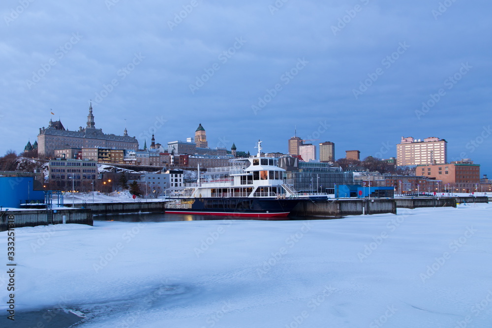 Upper and lower old town skyline seen from the Louise Basin during an early spring blue hour morning, Quebec City, Quebec, Canada