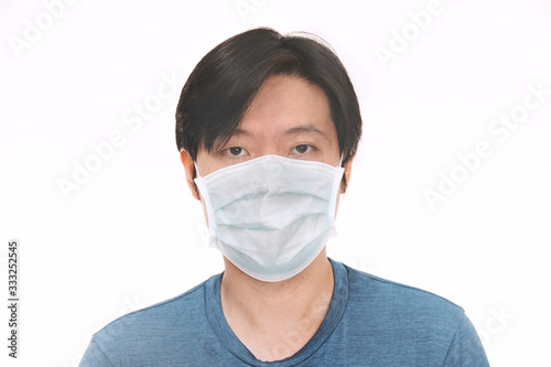 Portrait asian man wear mask to protect virus covid-19.