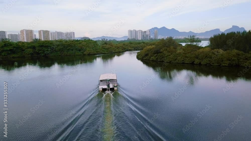 Aerial view of a vessel crossing a lake