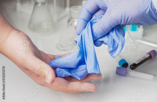 Handing over medical gloves