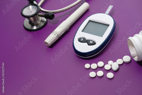  blood sugar measurement for diabetes, pills, and stethoscope 